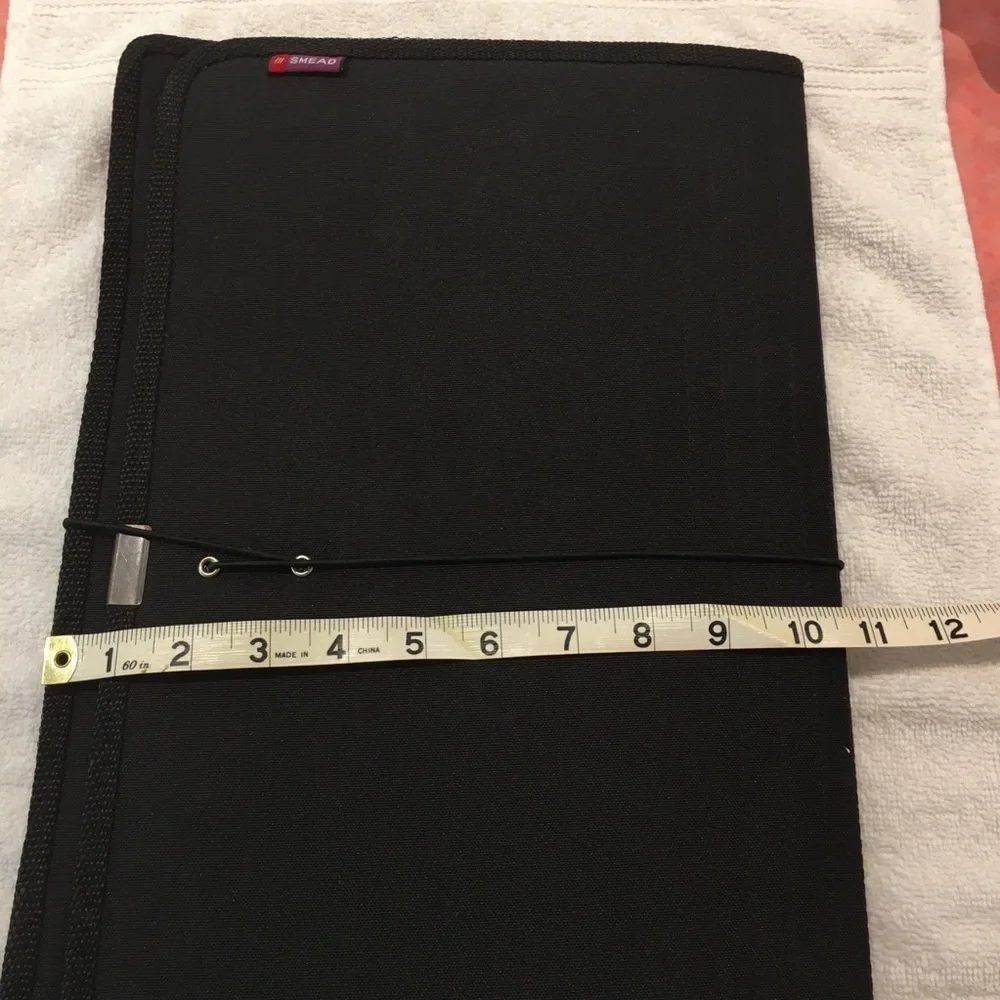 Portfolio legal size in black material. NWOT